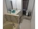 Bathroom featuring a large tub, double sinks, and neutral decor, creating a relaxing atmosphere at 1737 Griffin Ave, Lady Lake, FL 32159