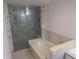 Bathroom showcasing a separate tub and shower with stylish marble tiling at 1737 Griffin Ave, Lady Lake, FL 32159