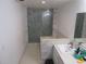 Modern bathroom featuring a spacious shower with marble-look tiling and a sink at 1737 Griffin Ave, Lady Lake, FL 32159