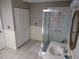 Bathroom featuring a glass enclosed shower, sink and large closet at 1737 Griffin Ave, Lady Lake, FL 32159