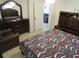 Bedroom with large bed and chair at 1737 Griffin Ave, Lady Lake, FL 32159