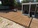Spacious wooden deck featuring comfortable seating and a view of the yard at 1737 Griffin Ave, Lady Lake, FL 32159