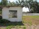 Dilapidated outbuilding near a pool with a white fence in the background at 1737 Griffin Ave, Lady Lake, FL 32159