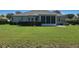 Green backyard with screened-in porch of home in desirable community at 2550 Nw 55Th Avenue Rd, Ocala, FL 34482