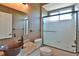 Bathroom featuring vessel sink, granite countertops, and a glass enclosed tub-shower combo at 2550 Nw 55Th Avenue Rd, Ocala, FL 34482