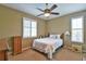 Comfortable bedroom featuring a window with plantation shutters and neutral color carpet at 2550 Nw 55Th Avenue Rd, Ocala, FL 34482