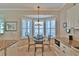 Bright breakfast nook featuring a table with seating for four, surrounded by a bay window with plantation shutters at 2550 Nw 55Th Avenue Rd, Ocala, FL 34482