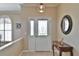 Bright entryway showcasing a decorative glass door, elegant lighting, and a stylish entry table at 2550 Nw 55Th Avenue Rd, Ocala, FL 34482