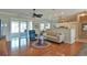 Cozy living room boasts hardwood floors, neutral tones, and access to a screened-in lanai at 2550 Nw 55Th Avenue Rd, Ocala, FL 34482