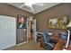 Office featuring a desk, chair, closet, and wall art that creates a conducive work environment at 2550 Nw 55Th Avenue Rd, Ocala, FL 34482