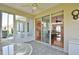 Sunroom featuring sliding glass doors leading to dining and living room at 2550 Nw 55Th Avenue Rd, Ocala, FL 34482