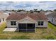 Aerial view highlighting the home's screened in back porch and generous backyard space at 2594 Berrington Loop, The Villages, FL 32162