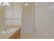 Bright bathroom featuring a vanity with sink and a tile floor at 2594 Berrington Loop, The Villages, FL 32162