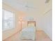 Bedroom with neutral carpet, a window with blinds, ceiling fan, and closet at 2594 Berrington Loop, The Villages, FL 32162