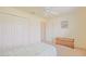 Bedroom featuring neutral carpet, closet space, and a window at 2594 Berrington Loop, The Villages, FL 32162