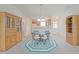Charming dining area with table and chairs, surrounded by built-in cabinets on each side at 2594 Berrington Loop, The Villages, FL 32162