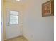 An inviting entryway features tiled flooring and a charming framed picture hanging on the wall at 2594 Berrington Loop, The Villages, FL 32162