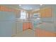 Well-lit kitchen featuring ample cabinet space and modern white appliances for functionality at 2594 Berrington Loop, The Villages, FL 32162