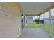 A screened patio includes a ceiling fan for air circulation while enjoying the outdoor scenery at 2594 Berrington Loop, The Villages, FL 32162