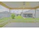 View from screened porch to grassy backyard at 2594 Berrington Loop, The Villages, FL 32162
