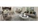 Open concept living room with modern furniture, bright natural light, and adjacent kitchen and dining area at 2945 Ne 21St Terrace Rd, Ocala, FL 34470