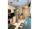 Functional kitchen with stainless steel appliances, light wood cabinets and tile flooring at 3106 Silver Palm Dr, Edgewater, FL 32141