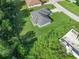 Aerial shot highlighting home on a large lot with lush green landscaping at 32 Pine Course Loop, Ocala, FL 34472