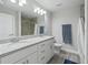 Modern bathroom with double sinks and a granite countertop at 32 Pine Course Loop, Ocala, FL 34472