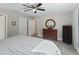 A well-lit bedroom with wood-look flooring and modern furnishings at 32 Pine Course Loop, Ocala, FL 34472
