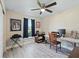 A home office featuring a ceiling fan, a dark wood desk and a window at 32 Pine Course Loop, Ocala, FL 34472