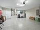 Spacious garage area with high ceilings, ample storage, and utility connections at 32 Pine Course Loop, Ocala, FL 34472