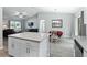 Open kitchen and living area showing stainless appliances, lots of counter space, and nice finishes at 32 Pine Course Loop, Ocala, FL 34472