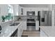 Updated kitchen featuring stainless steel appliances and granite countertops and sleek cabinetry at 32 Pine Course Loop, Ocala, FL 34472