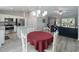 Open-concept kitchen and dining area with stainless steel appliances and a connected living space at 32 Pine Course Loop, Ocala, FL 34472