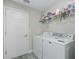 Bright laundry room featuring modern washer and dryer at 32 Pine Course Loop, Ocala, FL 34472