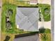 Aerial view showcasing the home's roof, well-maintained landscaping, and paved driveway at 3500 Countryside Path, The Villages, FL 32163