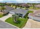 Overhead view of a single-Gathering home featuring a two-car garage and landscaped front yard at 3500 Countryside Path, The Villages, FL 32163