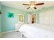 Spacious bedroom with ensuite bath, ceiling fan, and neutral colors at 3500 Countryside Path, The Villages, FL 32163