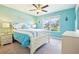 Comfortable bedroom with large window, white furniture, and coastal decor at 3500 Countryside Path, The Villages, FL 32163