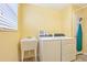 Laundry room with washer, dryer, wash basin and storage at 3500 Countryside Path, The Villages, FL 32163