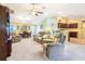 Open-concept living room flowing into dining area and kitchen; perfect for entertaining at 3500 Countryside Path, The Villages, FL 32163