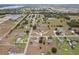 Wide aerial view showcasing the neighborhood and surrounding landscape at 4725 County Road 121D, Wildwood, FL 34785