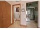 Hallway view of half bath and second living area at 4725 County Road 121D, Wildwood, FL 34785