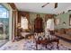 The home's living room features tile flooring and is decorated with various ornaments at 4725 County Road 121D, Wildwood, FL 34785