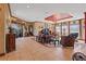 Large living room with tile flooring and views of the pool area at 4725 County Road 121D, Wildwood, FL 34785