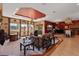 Spacious living room with decorative ceiling, and tile flooring at 4725 County Road 121D, Wildwood, FL 34785