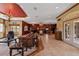 Expansive living space featuring comfortable seating and tile flooring at 4725 County Road 121D, Wildwood, FL 34785