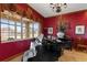 Grand piano situated near a window with lots of natural light at 4725 County Road 121D, Wildwood, FL 34785