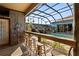 Poolside bar area with seating, waterfall view, and outdoor access at 4725 County Road 121D, Wildwood, FL 34785