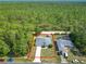 Single-story house featuring a well-maintained lawn and ample parking, close to green spaces at 5195 Sw 128Th Street Rd, Ocala, FL 34473